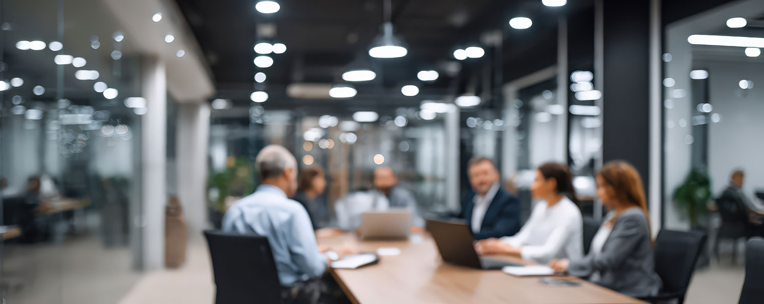 An image of people within a meeting room.