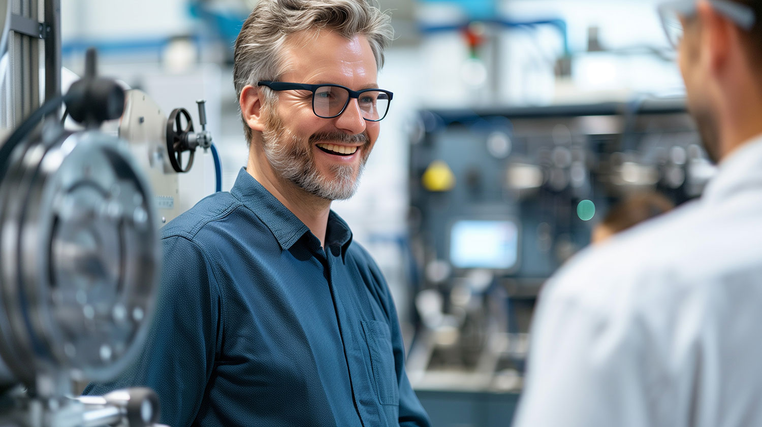 An image of the people discussing machinery.