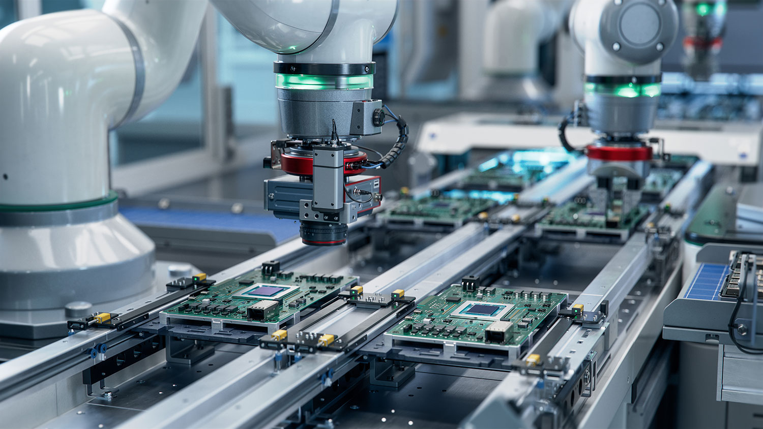 Robotic arms assembling electronic components on a high-speed automated production line.